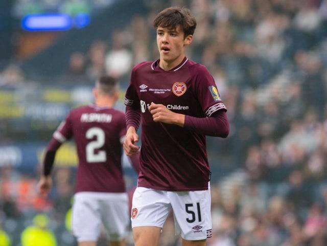 Photo: Celtic target Aaron Hickey pictured with Hoops scarf