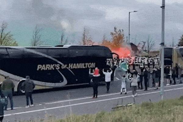 Celtic v Rangers: Hoops fans set off flares as they greet team coaches as hundreds march to Parkhead ahead of O** F***