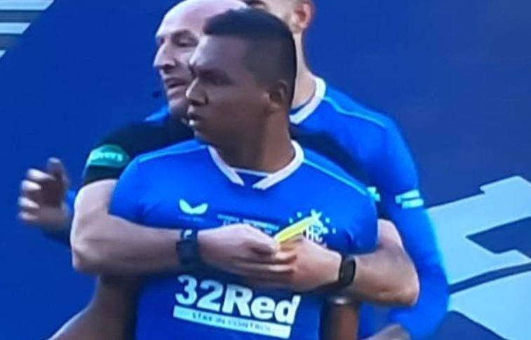 Photo: Bobby Madden lovingly holds back Alfredo Morelos to stop him getting sent off against Celtic