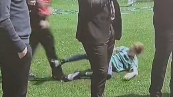 Watch Celtic steward hack down young fan who ran onto pitch as side celebrated winning Scottish Premiership title