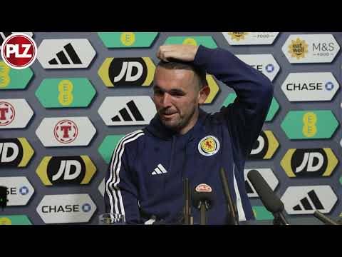 John McGinn reacts to Aston Villa being drawn against Celtic in the Champions League.