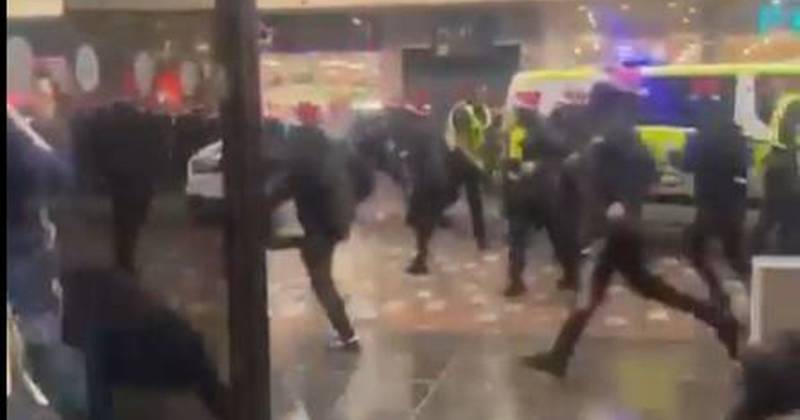 Celtic and Rangers fans clash forcing terrified shoppers to take cover in ugly scenes