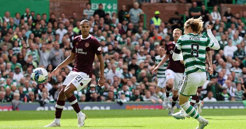 Celtic go two points clear at the top after brushing aside nine-man Hearts